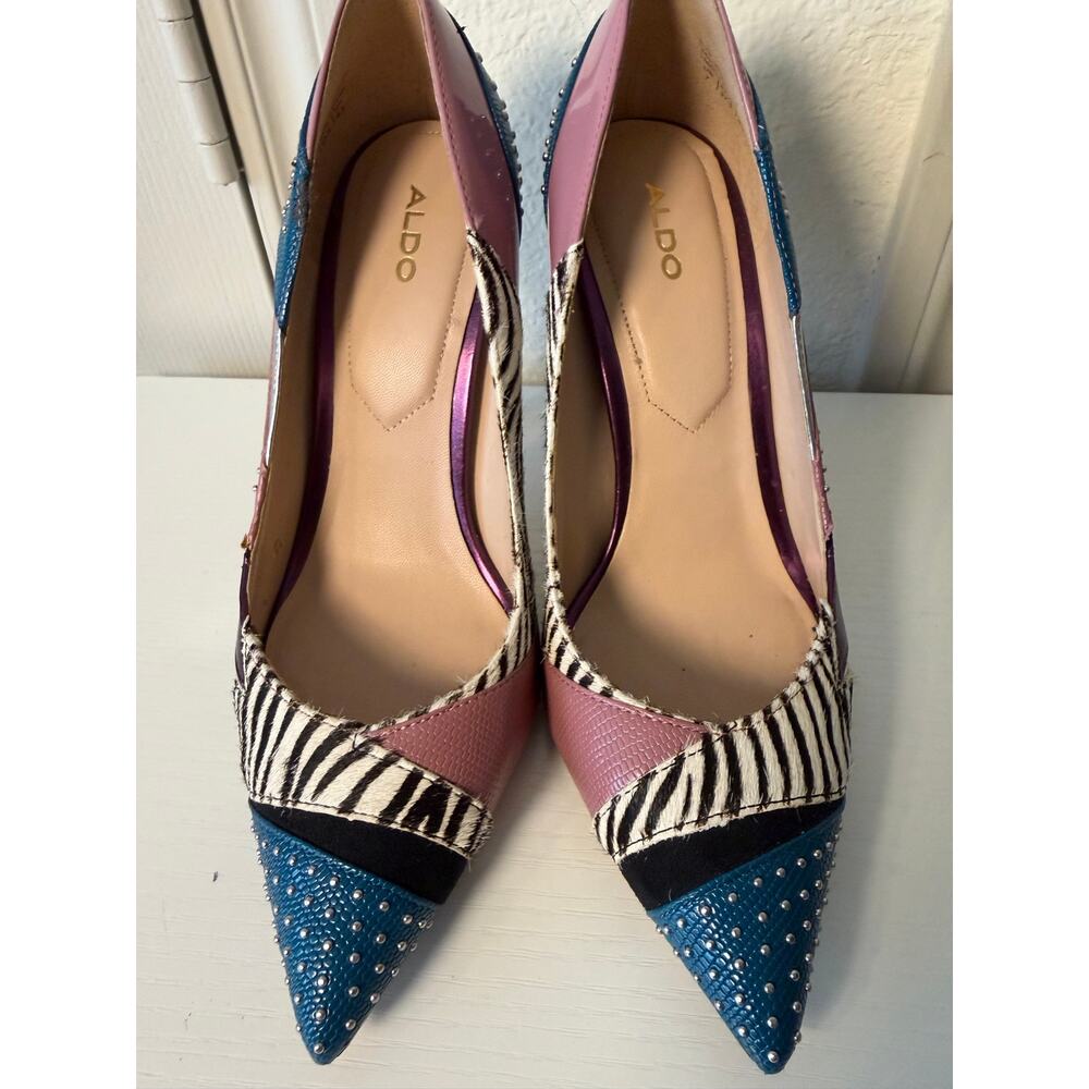These are Aldo Wicilidia animal print high heels featuring stud detailing.